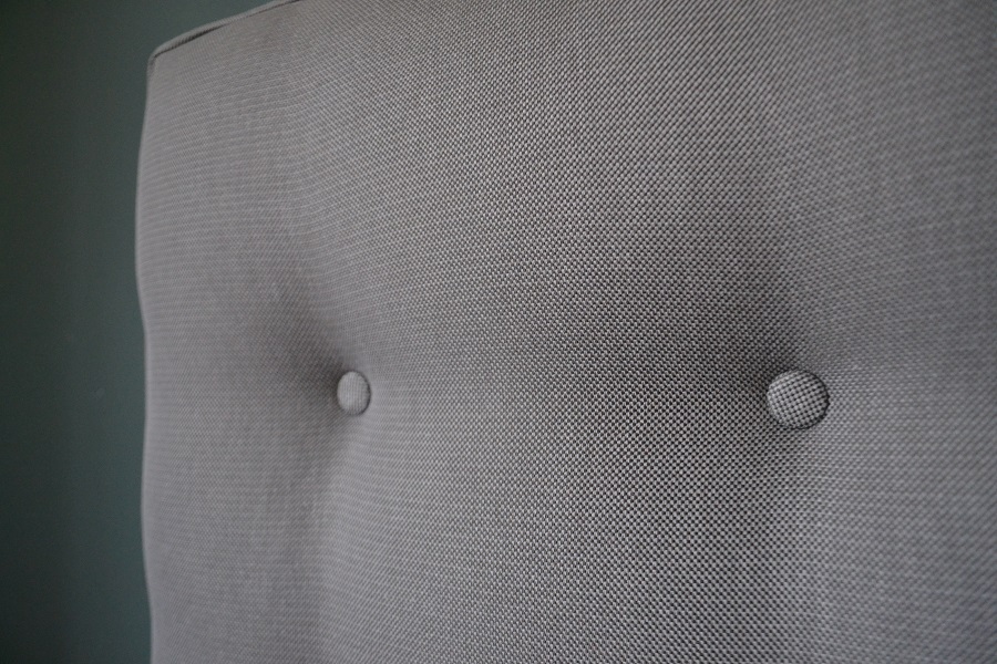 grey buttoned headboard